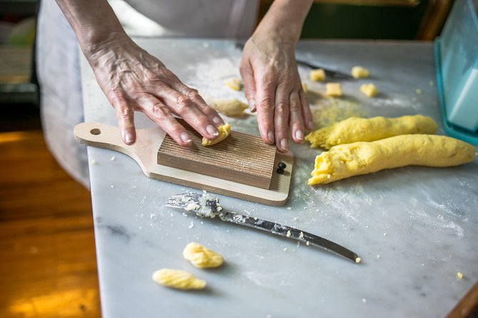 Cesarine: Market Tour & Cooking Class at Local's Home in Milan - Mercato di Porta Romana: Bringing It All Together Before the Cook-Off