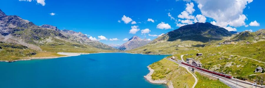 From Milan: Bernina Train Guided Tour to St. Moritz - Apple Monument in Milan to the first mountain transfer