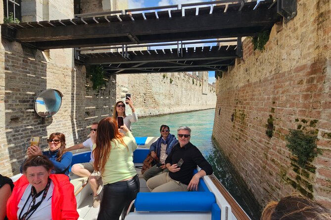 From Milan: Verona, Sirmione and Lake Garda Tour with Boat Cruise - Lake Garda boat cruise: private time on the water, with a weather catch