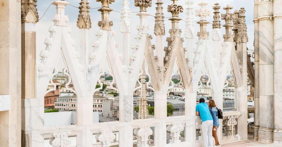 Marble spires and statues on the roof of Milan Cathedral