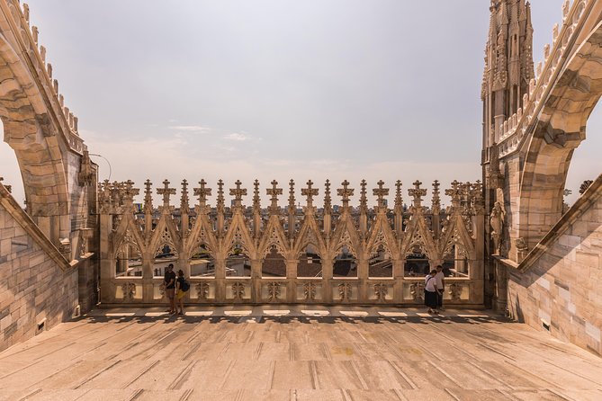 Milan Duomo Rooftop Terrace Guided Tour - Piazza del Duomo stop: reading the façade like a pro