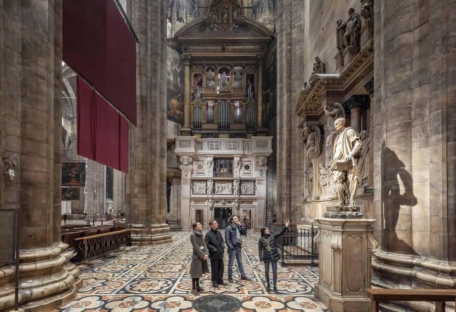Milan: Private City Tour With Milan Cathedral & Terraces - Entering the Duomo: marble, Gothic detail, and the five-century story