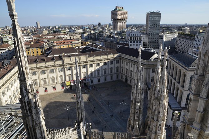 Milan Super Saver: Skip-the-line Duomo and Rooftop Tour - Inside Duomo Di Milano: statues, stained glass, and the Holy Nail legend